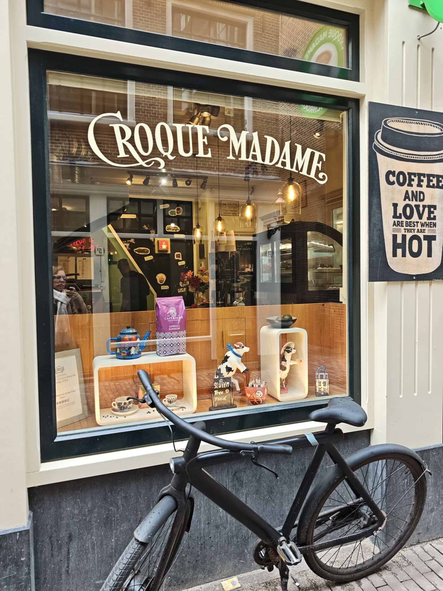 Croque Madame café front in Amsterdam, a bicycle parked outside.