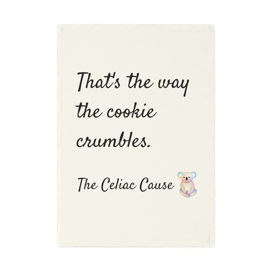 Cream tea towel reading That's the way the cookie crumbles.