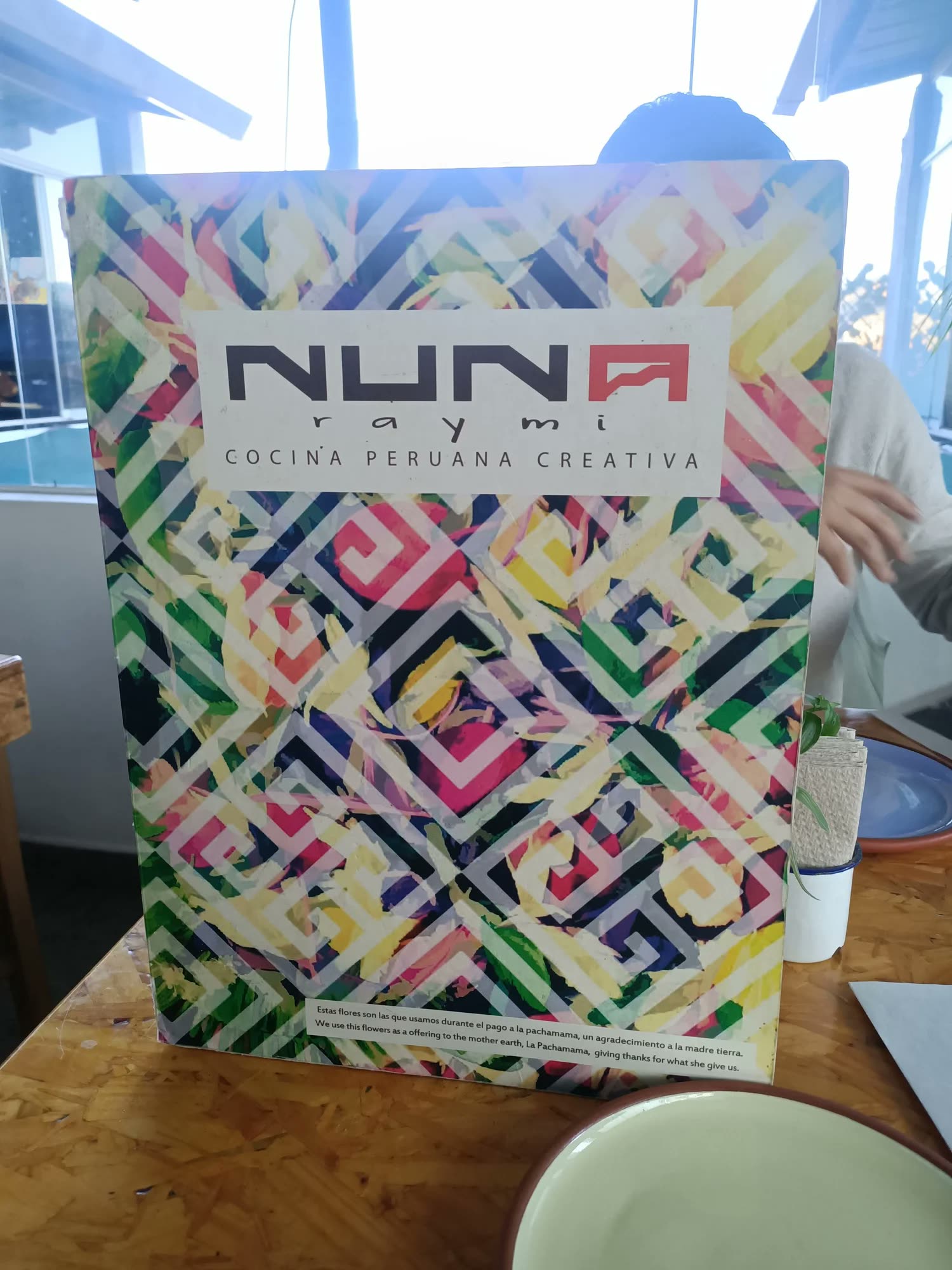 The colourful patterned menu of Nuna Raymi in Cusco.